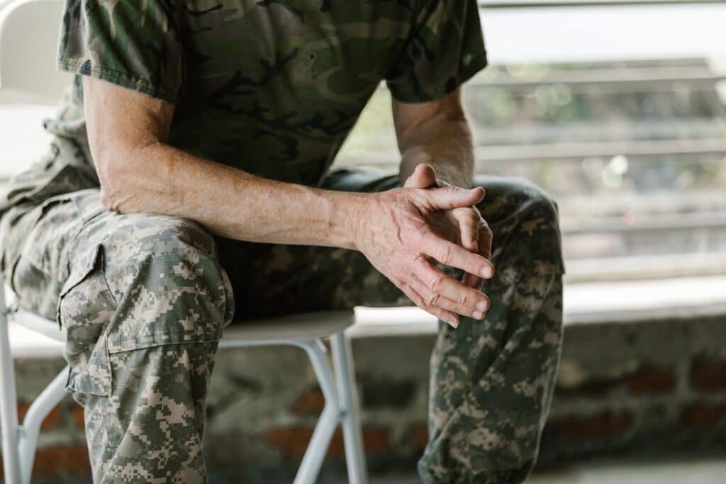 Veteran speaking in therapy session of military sexual trauma